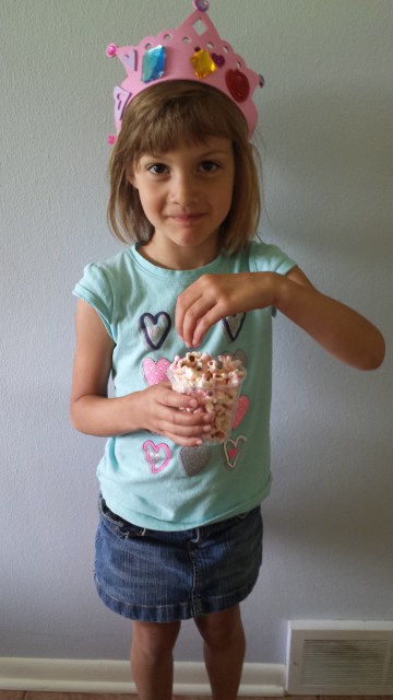 Here’s my little princess Skyler with her tiara and popcorn.