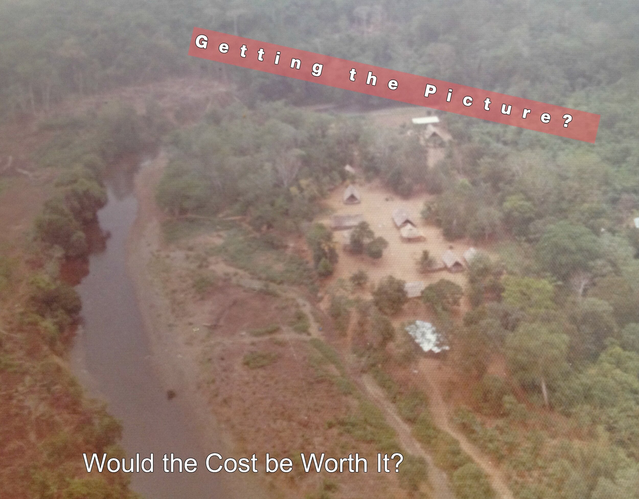 This is an aerial veiw of our house with the tin roof in the foreground