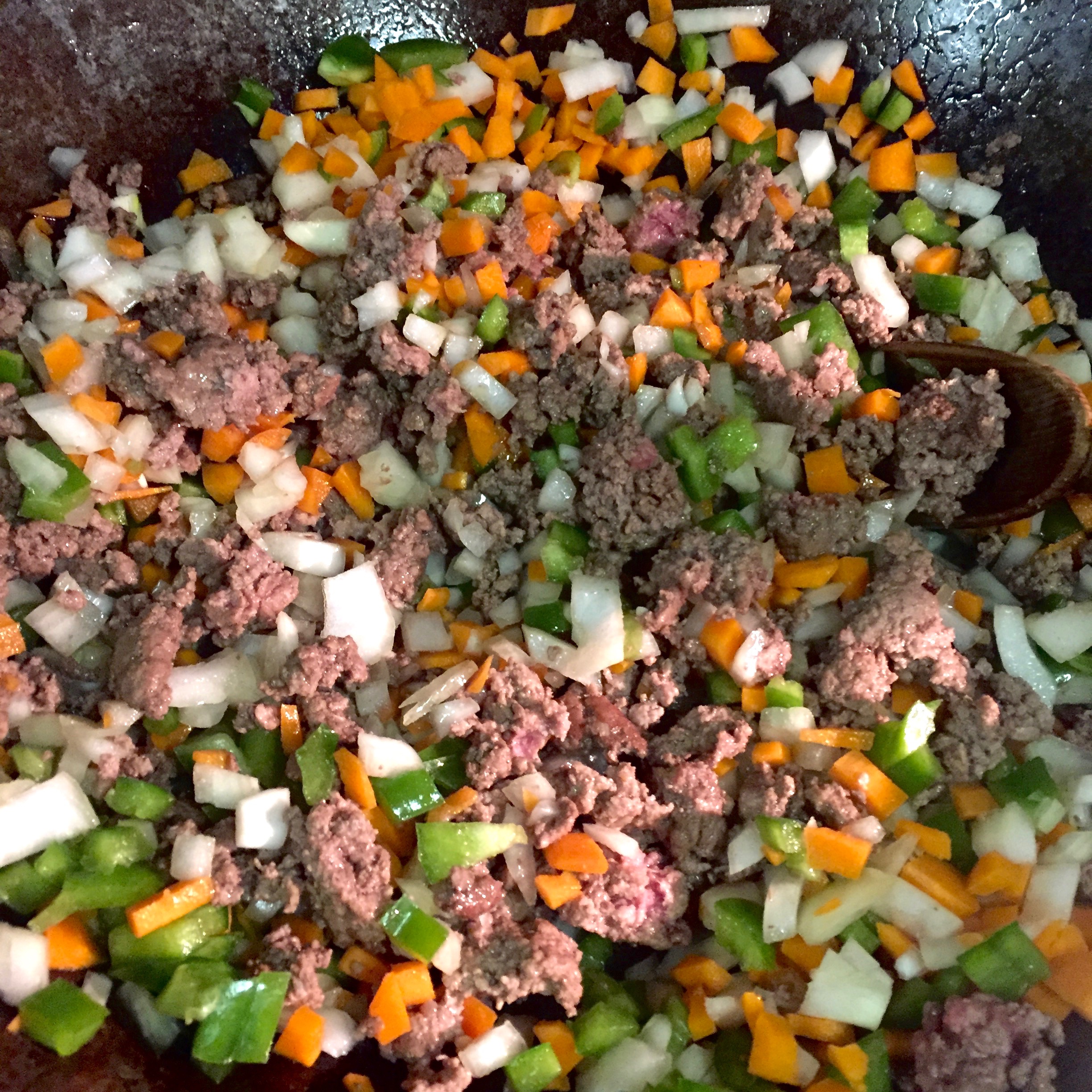 Sauteing the vegetables and meat