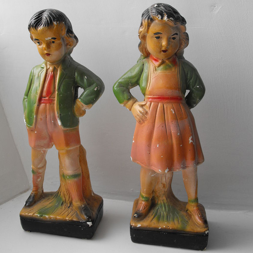 Chalkware boy and girl