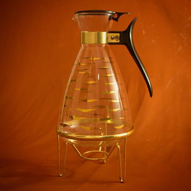 Pyrex lidded carafe with gilt detail &amp; stand | Mid century | Spring loaded lid. It can take a candle flame under the base to keep coffee warm ☕️ 12 cup capacity. &bull; $45 +shipping &bull;  Great vintage condition for its age, glass is flawless.