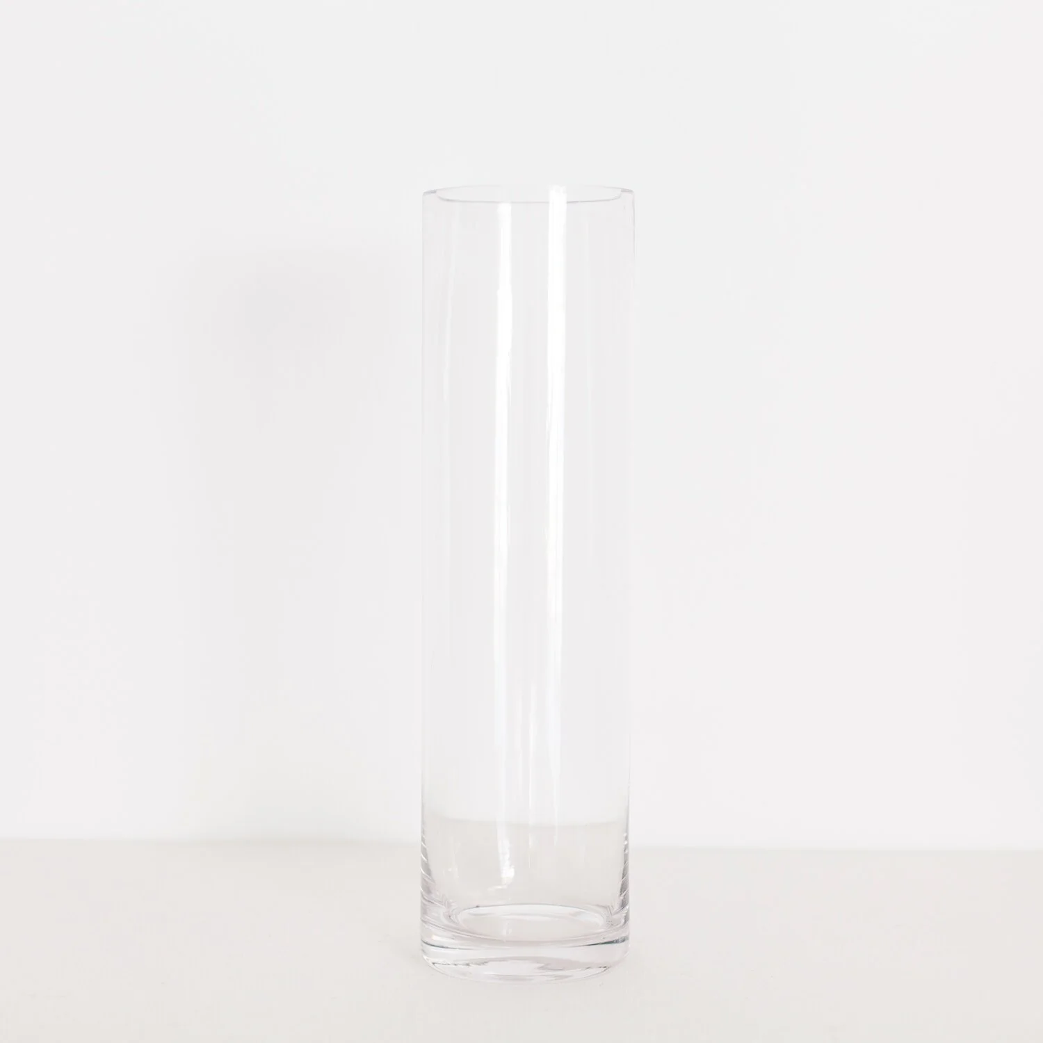 TALLER GLASS CYLINDER $ 4.00 / 12 in stock 15.5” tall, 4.5” wide