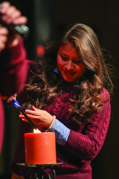 Senior Debbie Pinto lights Union’s Sabbath candle. | PC: Marketing Communications