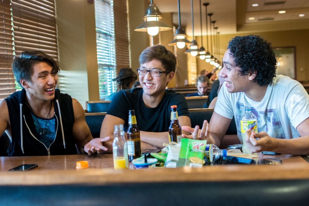 Senior Aaron Pineda, freshman David Lee and sophomore Roy Obregon chat during a meal Union Market. | PC: Zach Morrison
