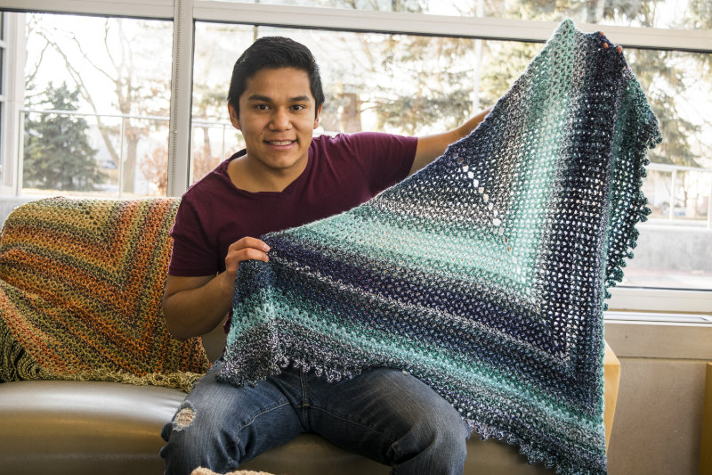 Nathan Mena shows off his wares. Check em out at: etsy.com/shop/hookedadornments. | PC: Jorrdan Bissell