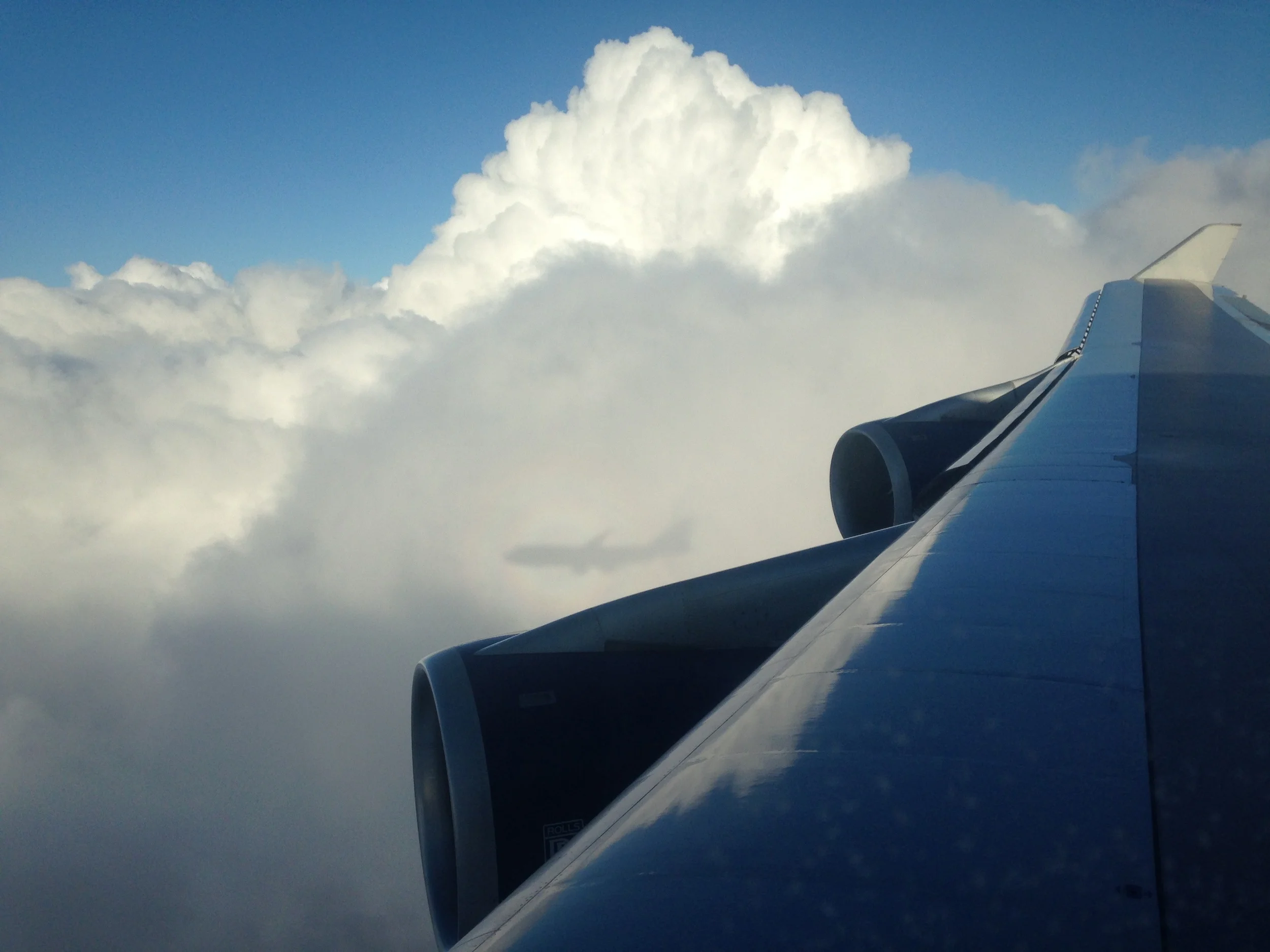 The 747's shadow, on clouds above London