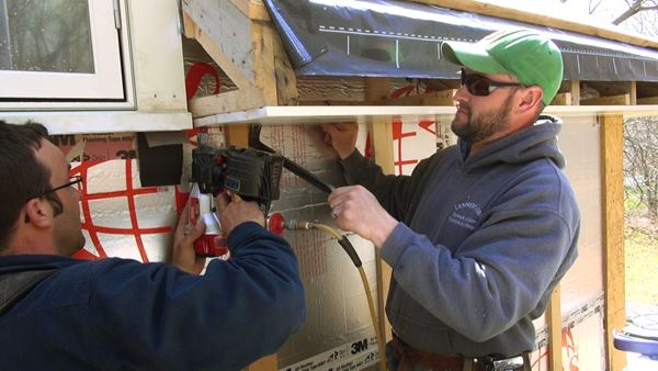 The third soffit board is persuaded into position then fastened. The three pieces were laid out so the outer board would have the same reveal as the inner board after the frieze and bed molding are installed on the wall.