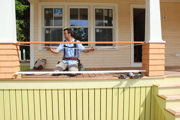 Holding the sub-top-rail in place to check the fit.