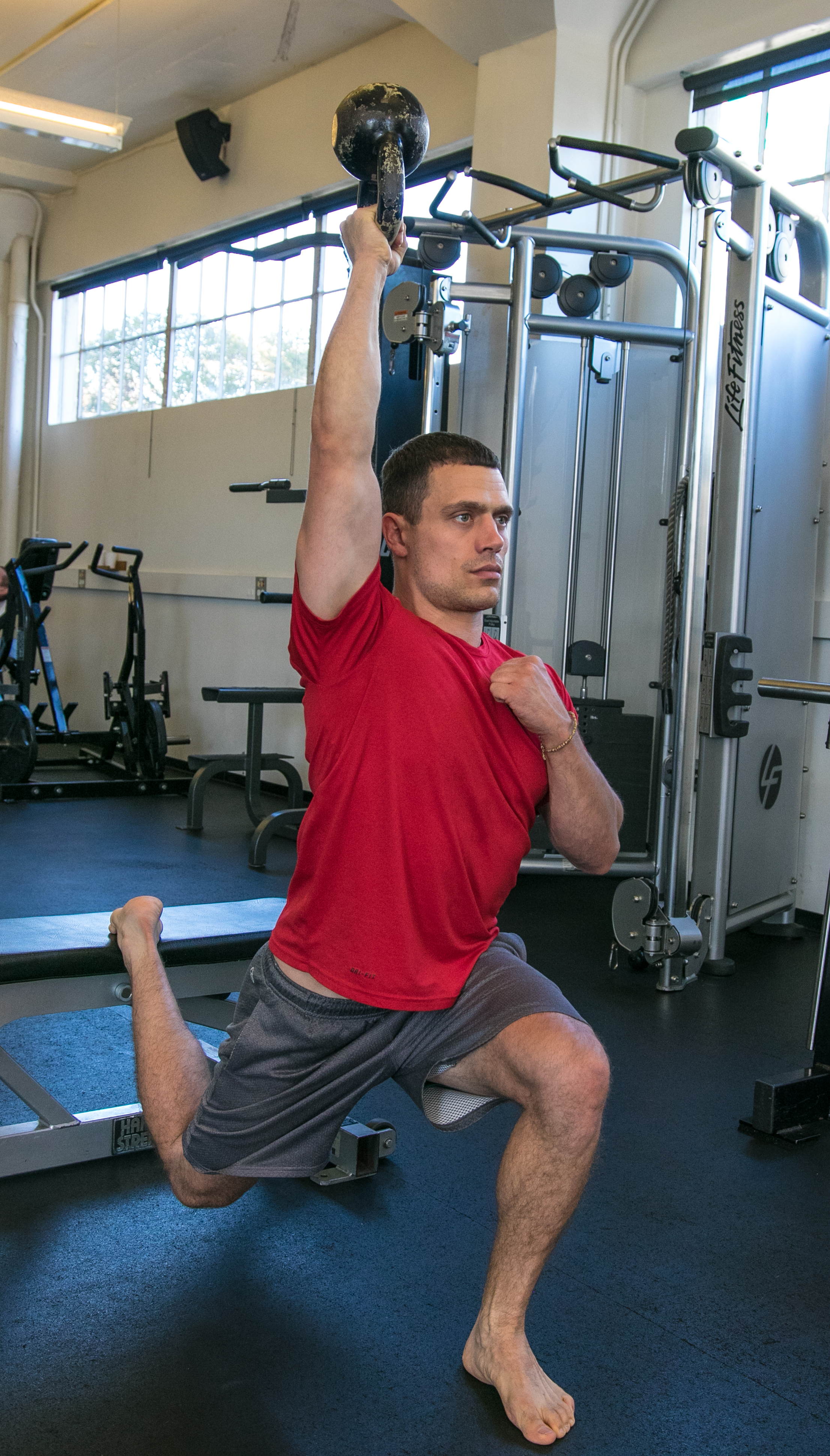Tycho Bergquist bulgarian split squat overhead kettlebell hold institute of motion.jpg