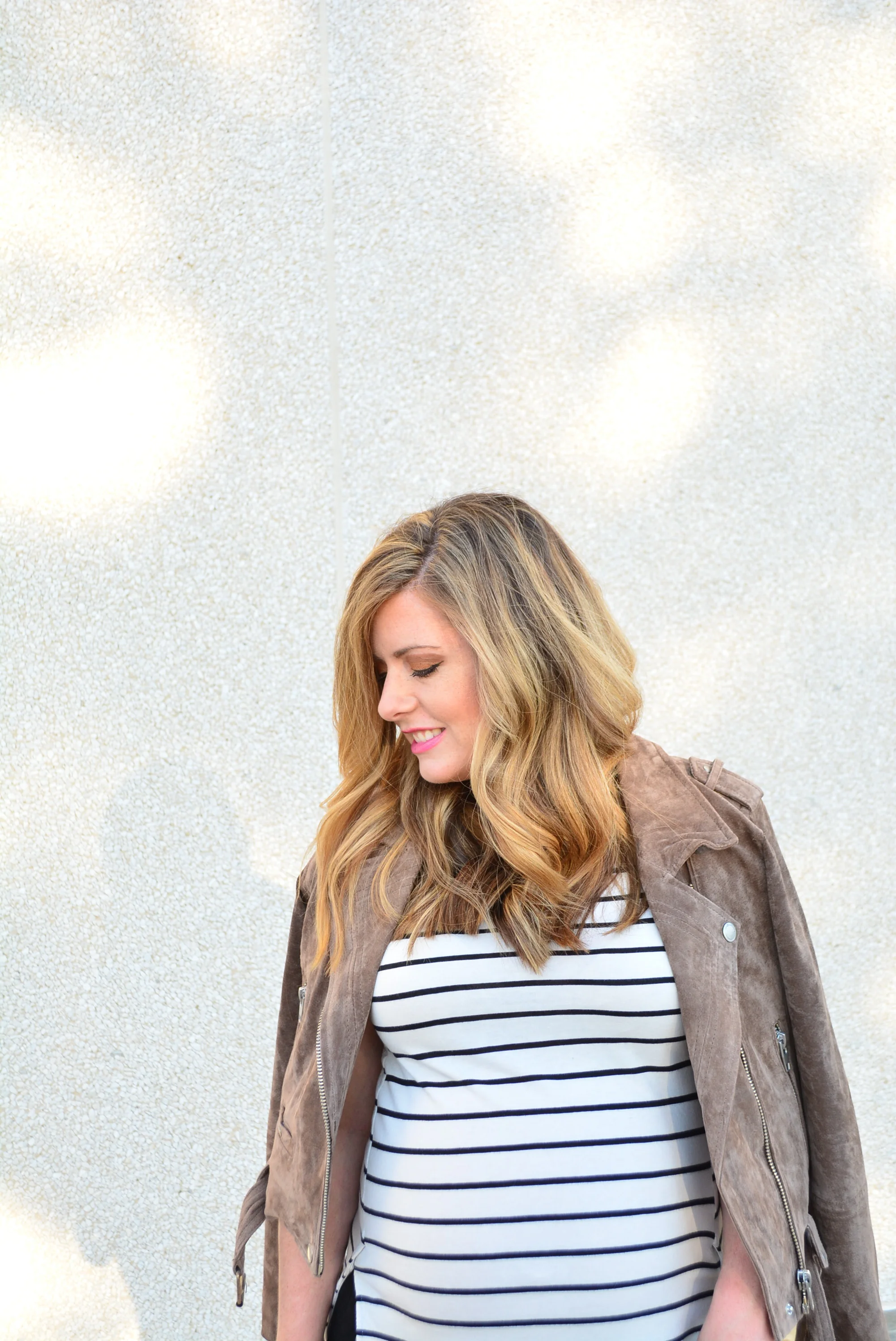 Moto jacket with stripe tee and joggers for a cute maternity look