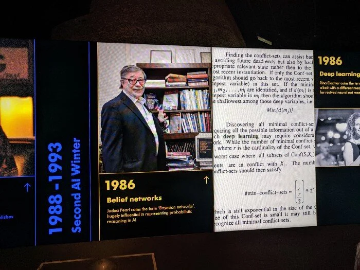 A historical timeline info board about the importance of Judah Pearl and Bayesian networks in the history of AI, from the “AI: More than Human” exhibition at London’s Barbican Centre, August 2019