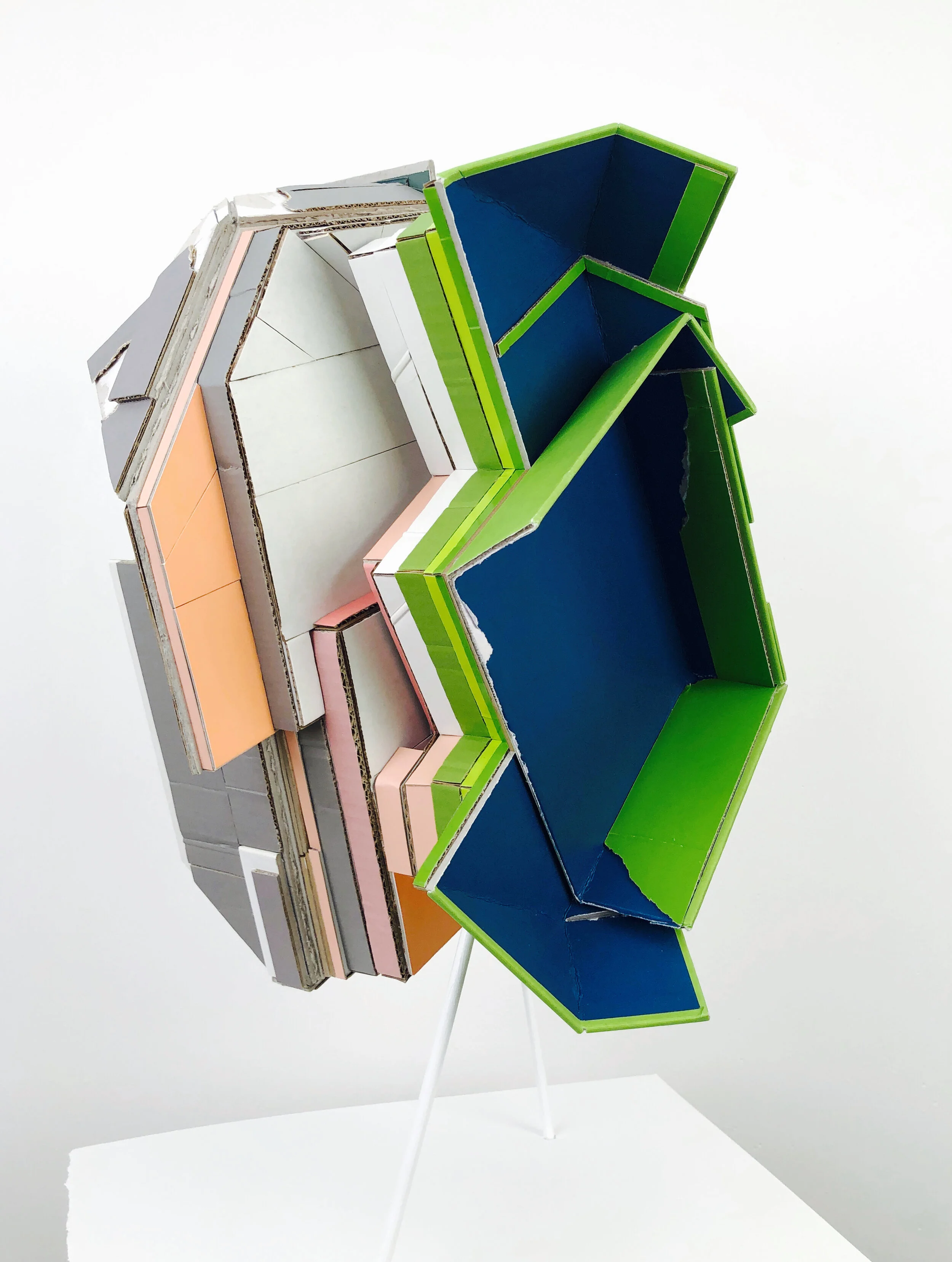    Carrier 1 (Outside courts)  , 2020  found (unpainted) cardboard, cut book covers, foamcore, wood dowels  10L x 10.5W x 21.5H inches 