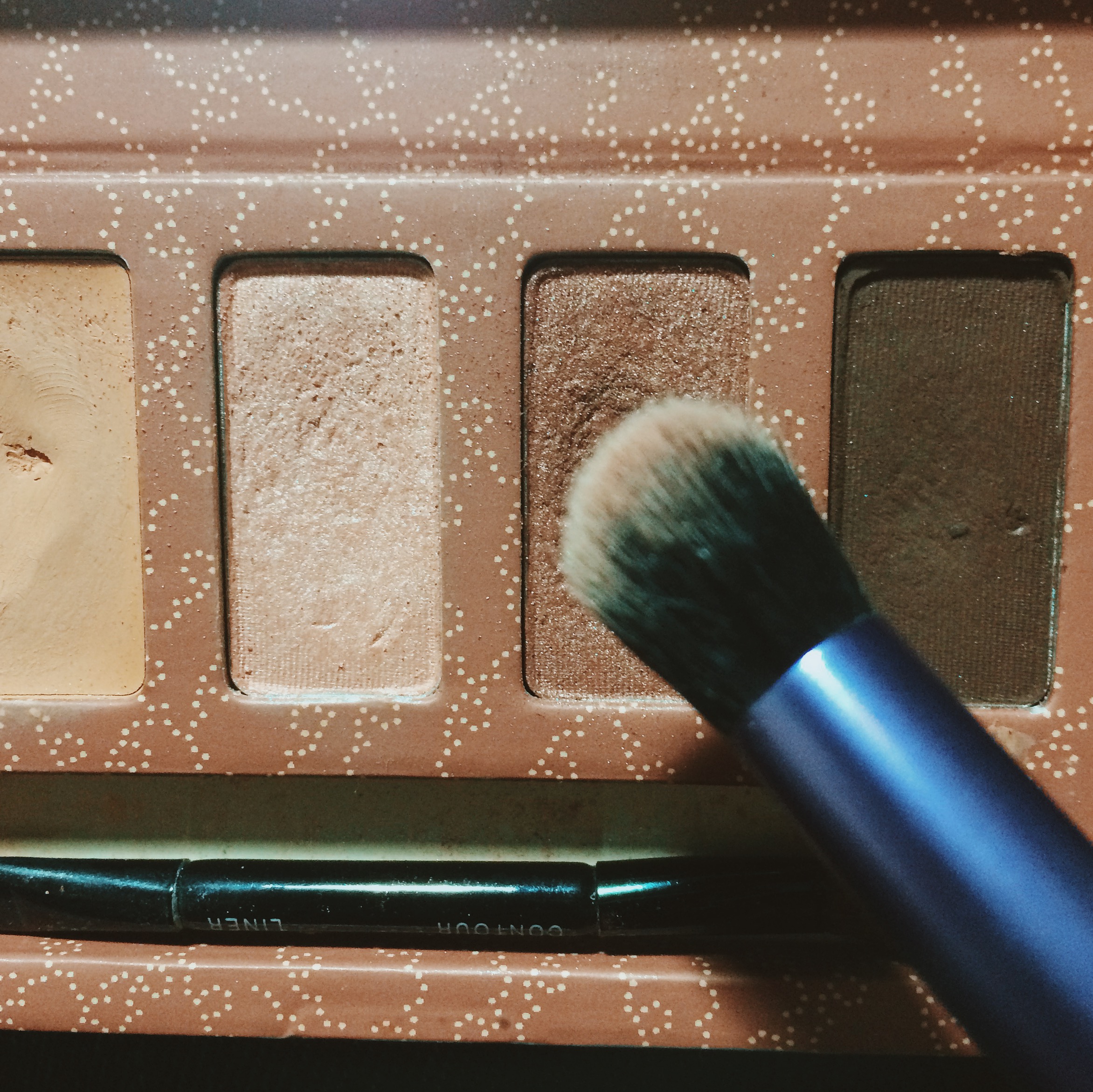 Using a crease brush, take the second color and pack that onto your crease. I do a half moon motion kind of swiping only concentrating on my crease.