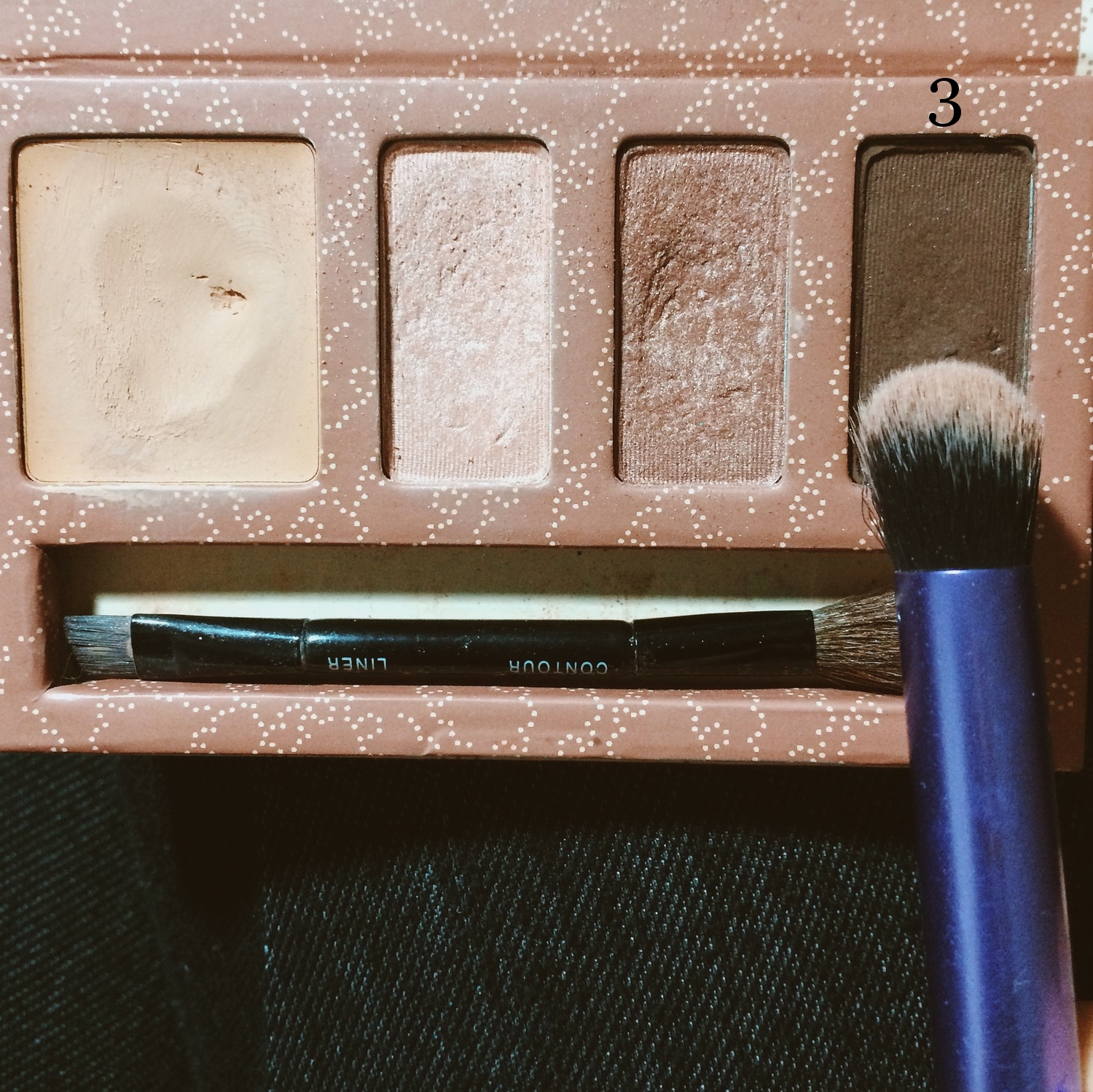 Using the same crease brush, take the 3rd shadow and pack it on the outer corners of your eyes forming a v-shape. I find this the hardest thing to do but don't worry, just keep blending if it starts to look a little crazy.