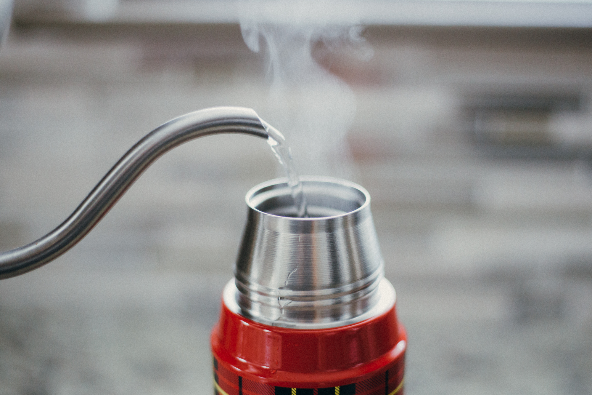  Warm up Thermos® bottle with hot water. 