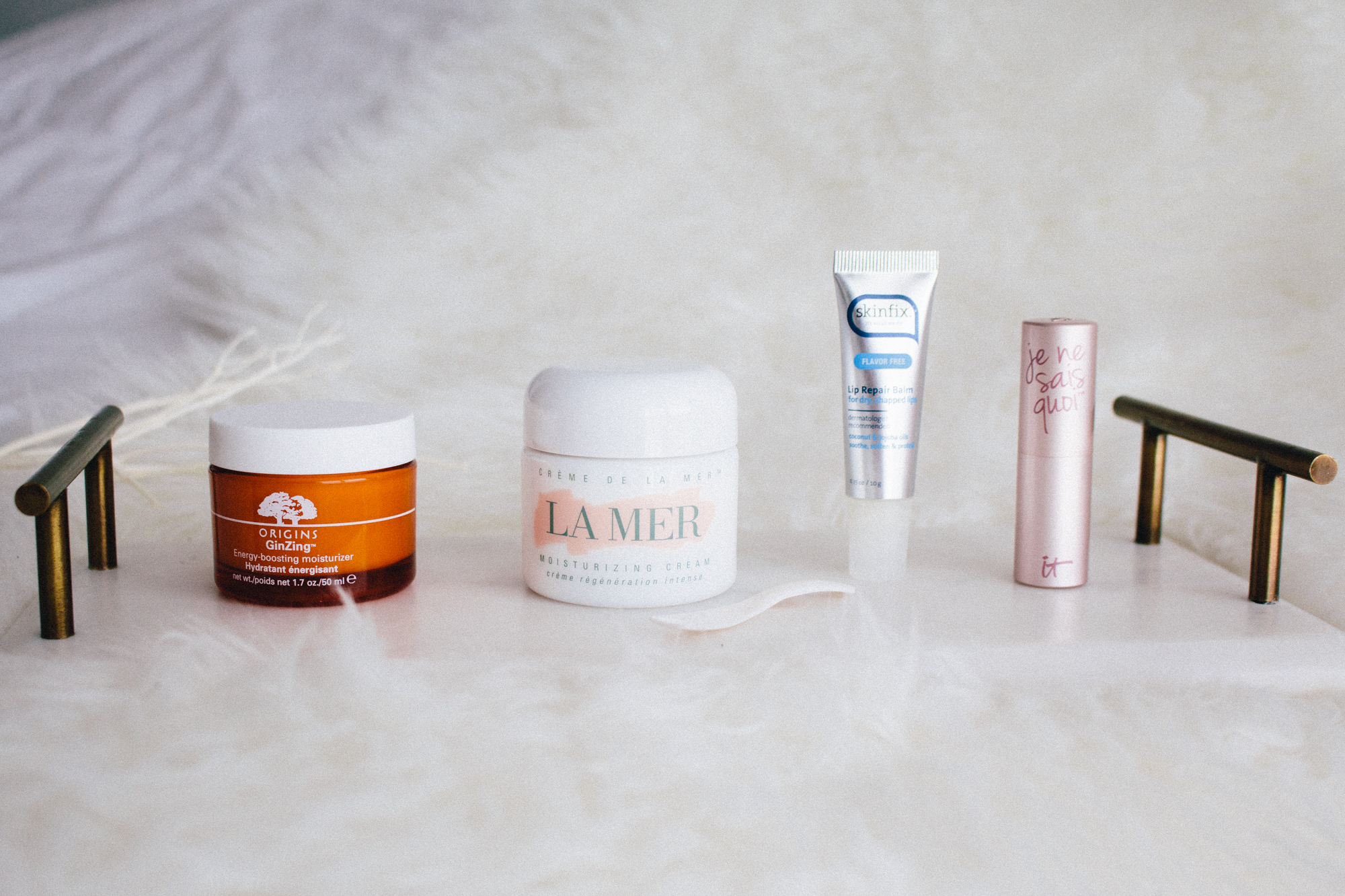 Origins GINZING MOISTURIZER • La Mer CREME DE LA MER MOISTURIZING CREAM • Skinfix LIP REPAIR BALM • IT Cosmetics JE NE SAIS QUOI HYDRATING LIP TREATMENT