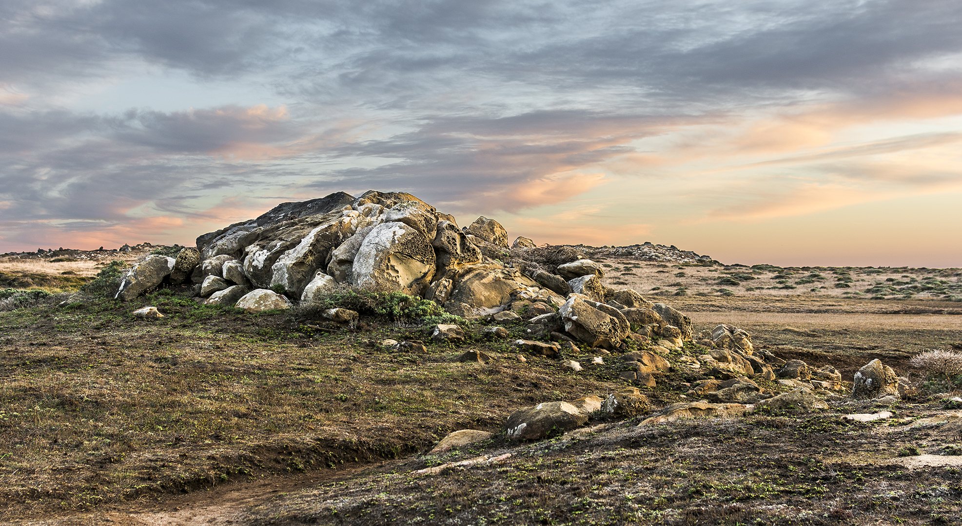 Pic 3 . An outcrop of boulders pokes out of the otherwise flat landscape of Salt Point State Park on the northern California coastline