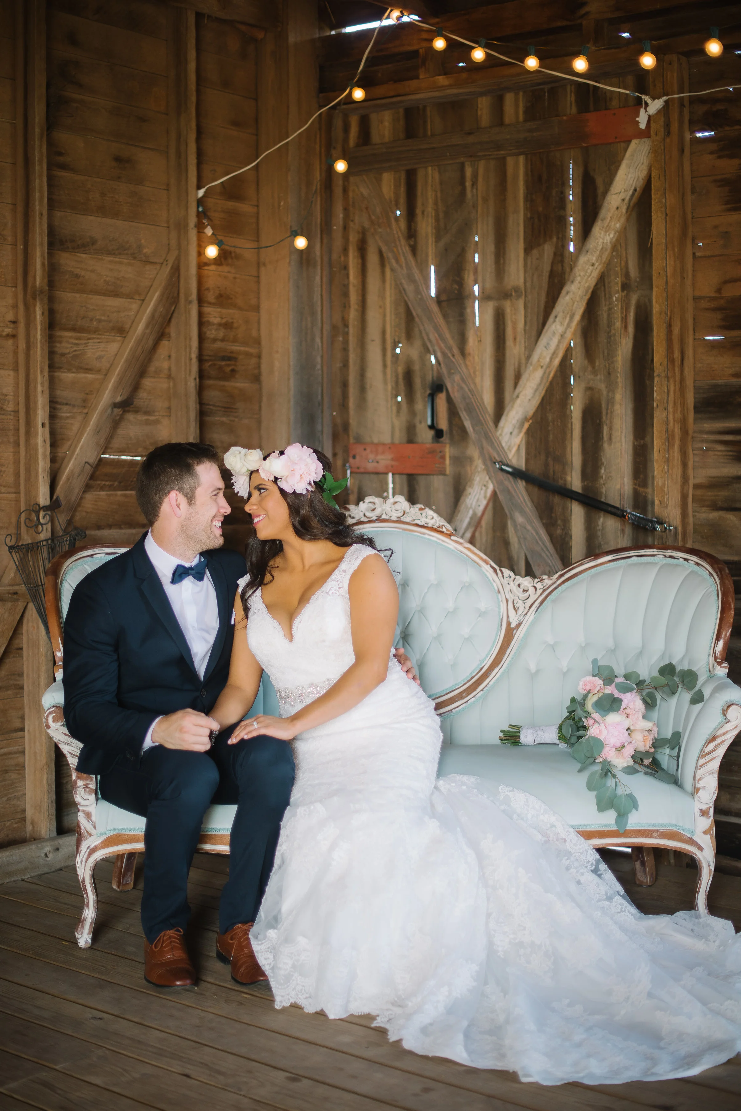 The pairing of rustic and chic was executed perfectly with this beautiful couch from Ruby's Vintage Rentals http://rubysvintagerentals.com