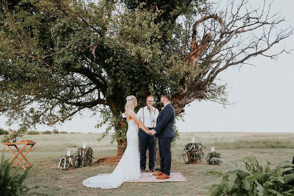 Fresh ferns guide the couple down the aisle, and give even more greenery to the event!