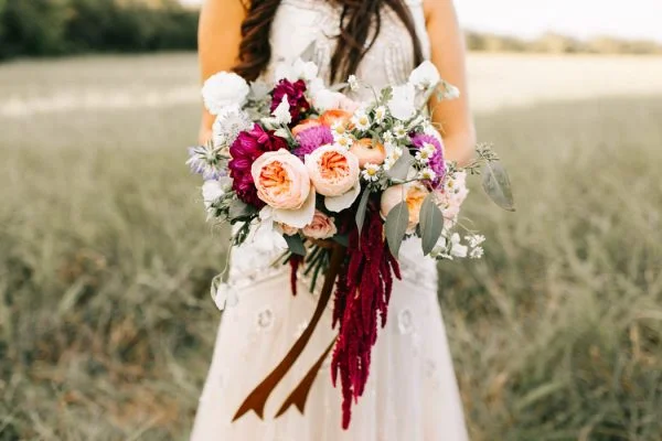 Alongside a gorgeous floral crown, the deep red, yellow, and purple flowers of Alexa's bouquet gave a perfect romantic, fall feeling! 