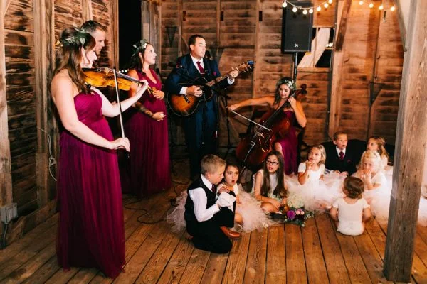 With their nieces and nephews as back up singers, members of their bride and groom's family performed "Rivers and Roads" by The Head and The Heart for their first dance! A beautiful surprise!