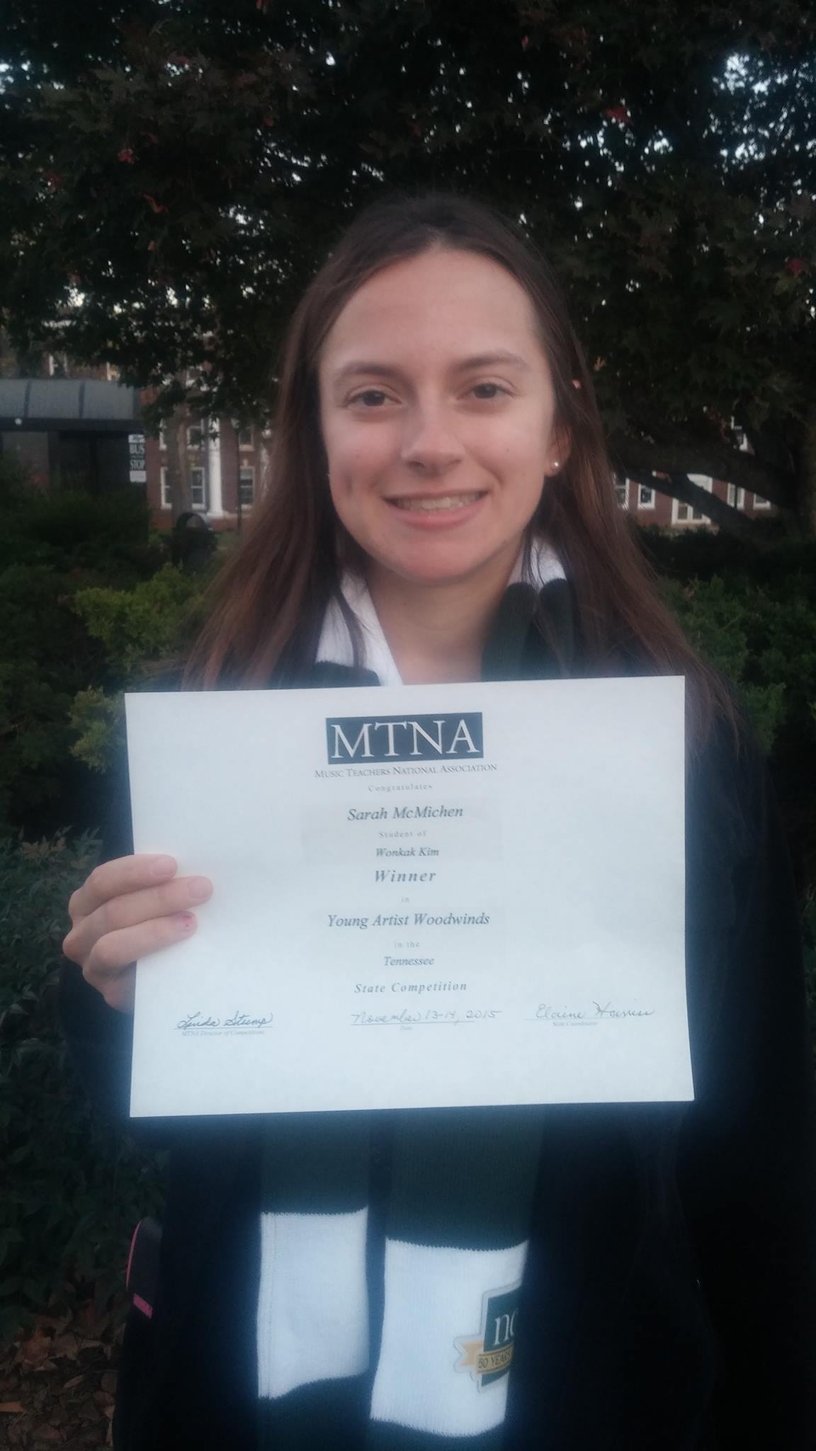 Sarah with her award certificate - MTSU campus