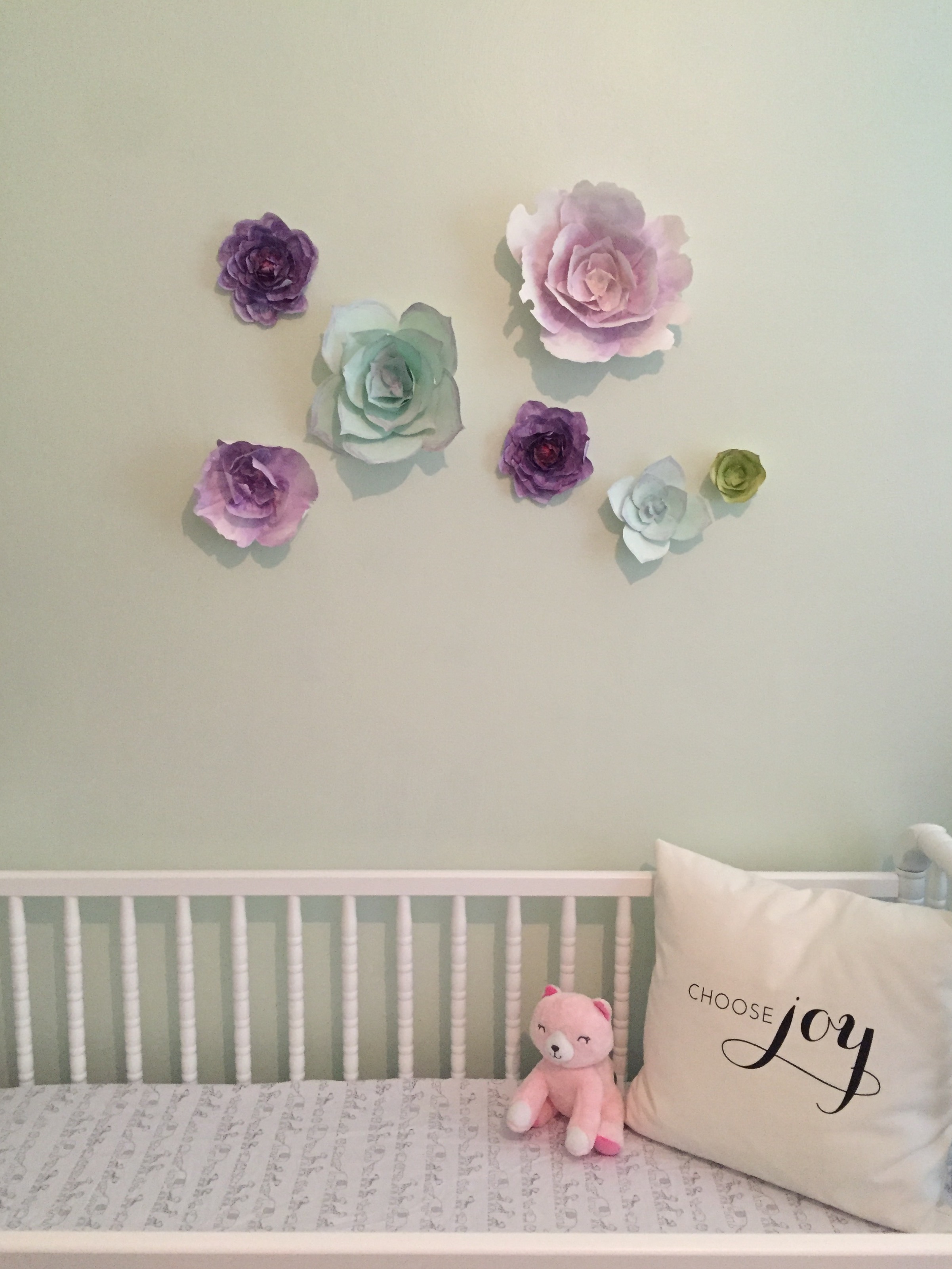 These beautiful paper flowers were made for my branding shoot by my friend Camberly of Sweet Pear Paper . I didn't want to hang anything heavy over the crib and these are just paper - BINGO! ps- YES, I know you can't keep a pillow in an infant's crib.