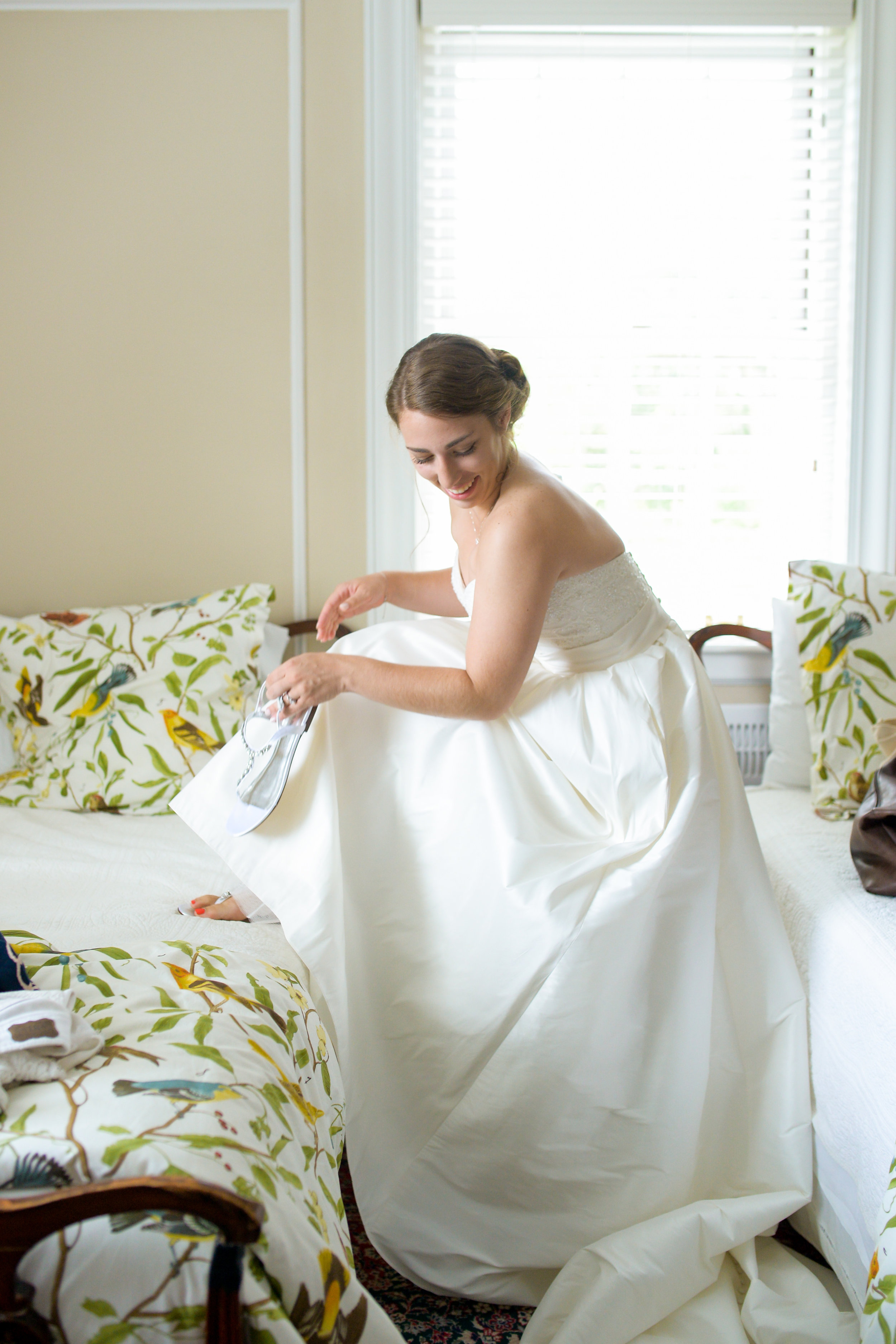 James of 88 Love Stories Photography got this adorable shot of Katie! I love the pops of color from the comforters! Beautiful and candid.