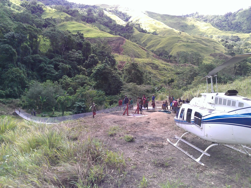 Helicopter at community development charter for footbridge construction, Papua New Guinea (PNG)