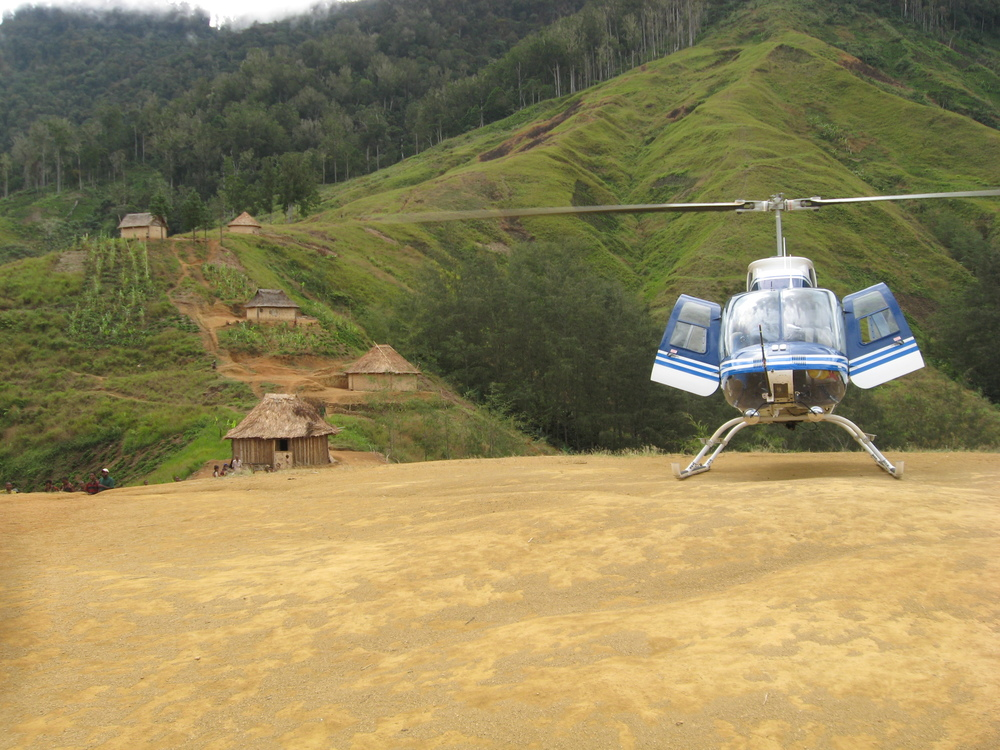 Helicopter in village, Papua New Guinea (PNG)