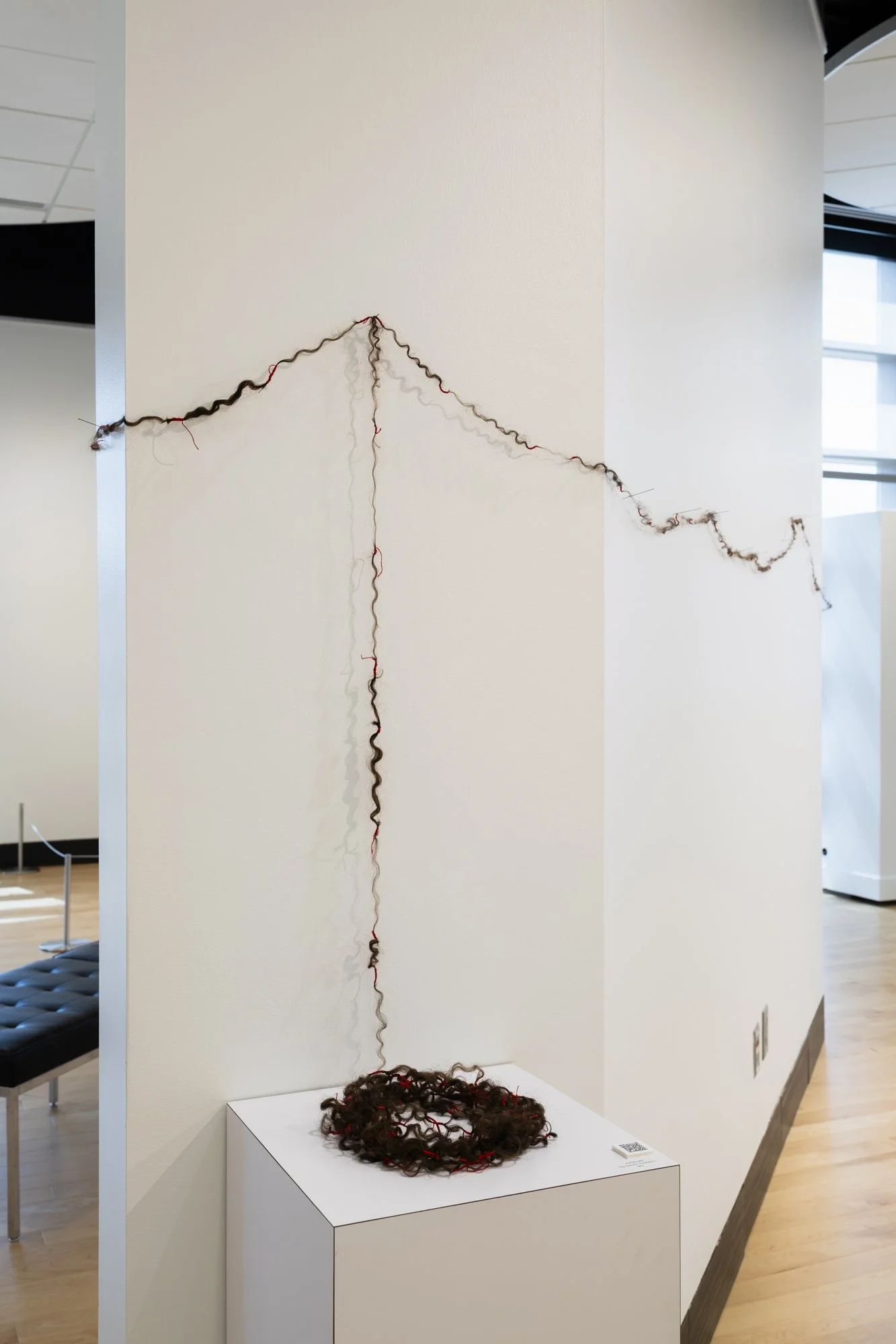 wait/weight, site specific installation: artist's hair, red silk thread