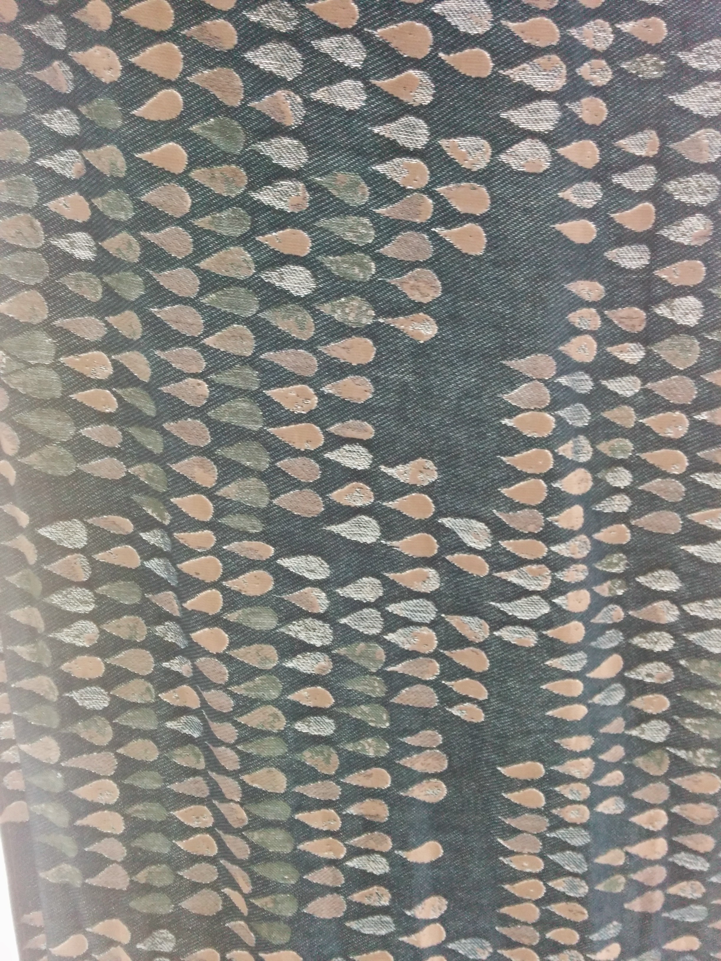 Here, the wrap is being held in a single layer, in front of a window with the blue side facing the camera. You can see the different densities in the wrap and the variations within the droplets.