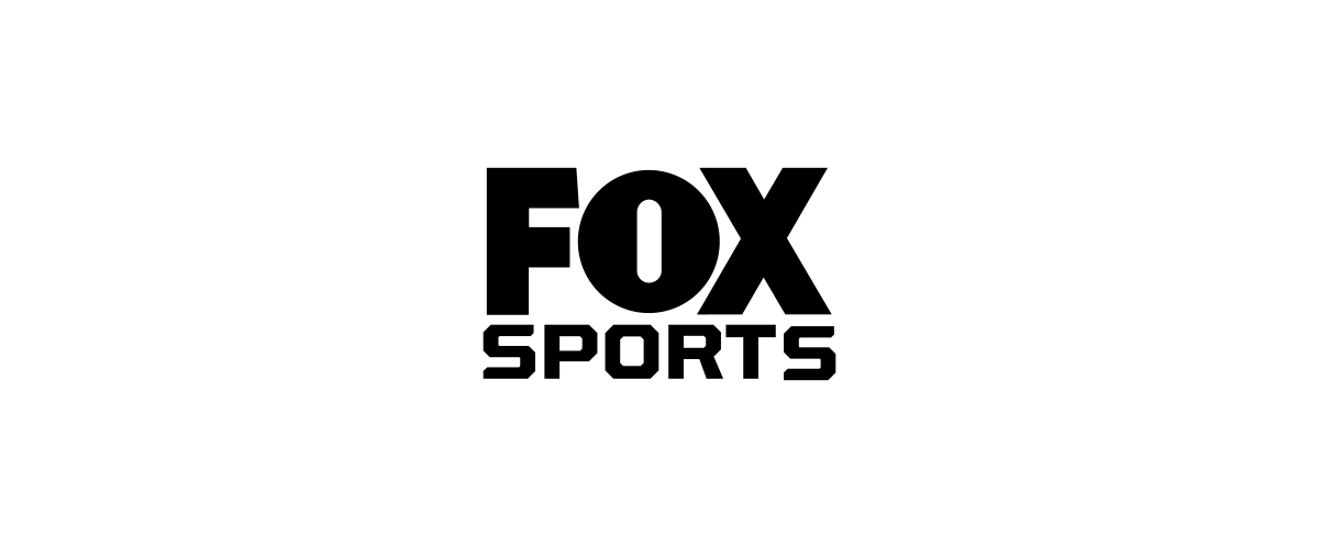 A black silhouette of a cat sitting on a branch.