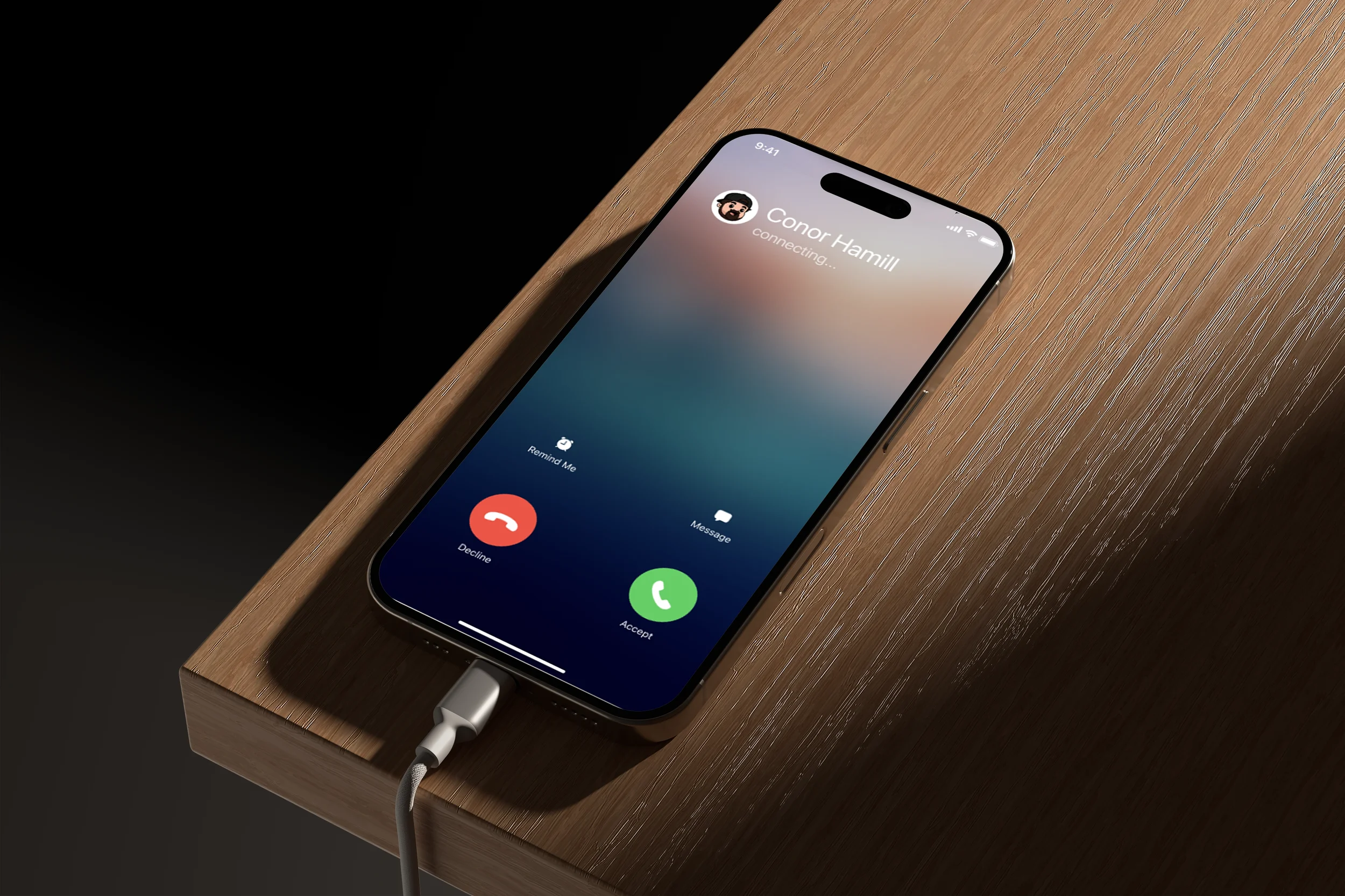 Smartphone on a wooden surface displaying an incoming call from Conor Hamill, with options to accept or decline the call.