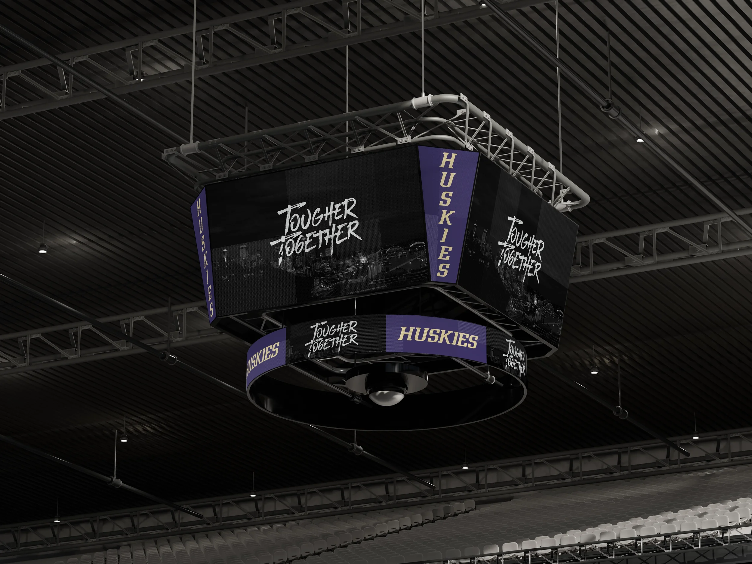 A digital scoreboard in an indoor arena displaying the text 'Tougher Together' and 'Huskies' along with images of a city skyline.