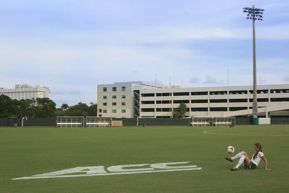 University of Miami Women’s Soccer Captain Shannon McCarthy, 20, is sit-down juggling on the the field of Cobb Stadium before a home game against Virginia Tech. Sit-down juggling helps to train the player to keep their ankle locked, which is useful when they strike a ball. 📷: Nicole Saunders
