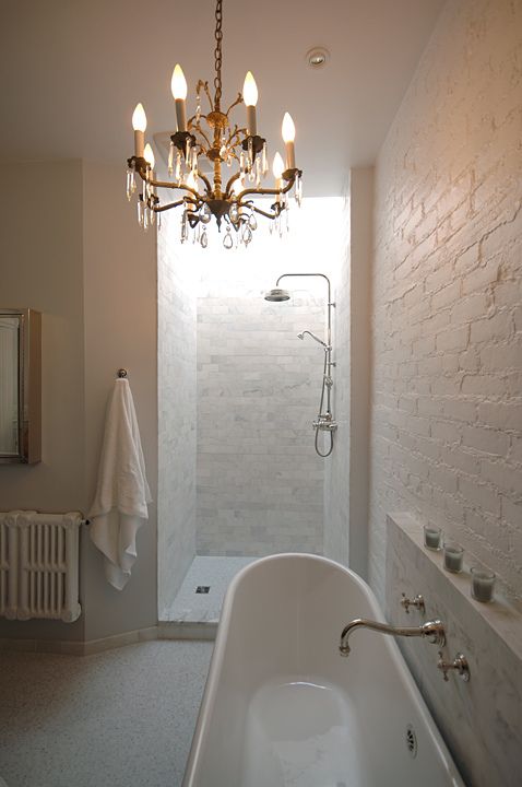 Refine your bathroom with a chandelier and get that hotel mood.