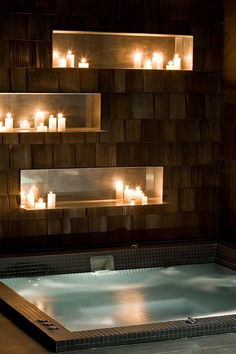Use candles to get the cozy and romantic feeling even in a very minimalistic styled bathroom.