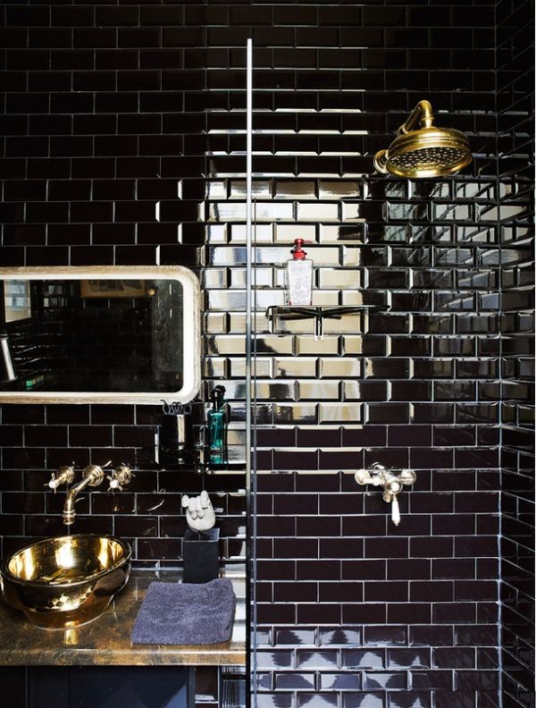 Black tiles and brass in bathroom. Uber cool !