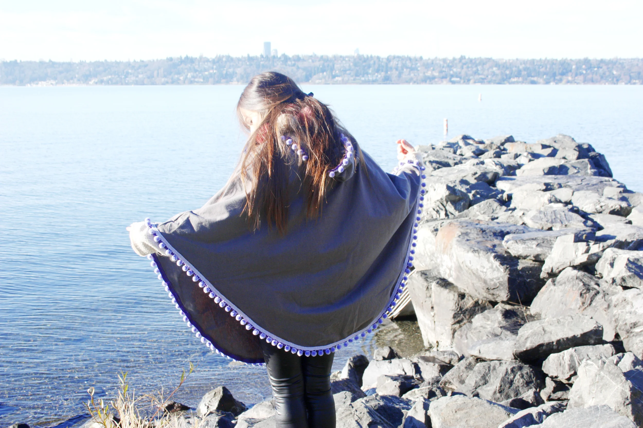 A beautiful handmade pompom poncho