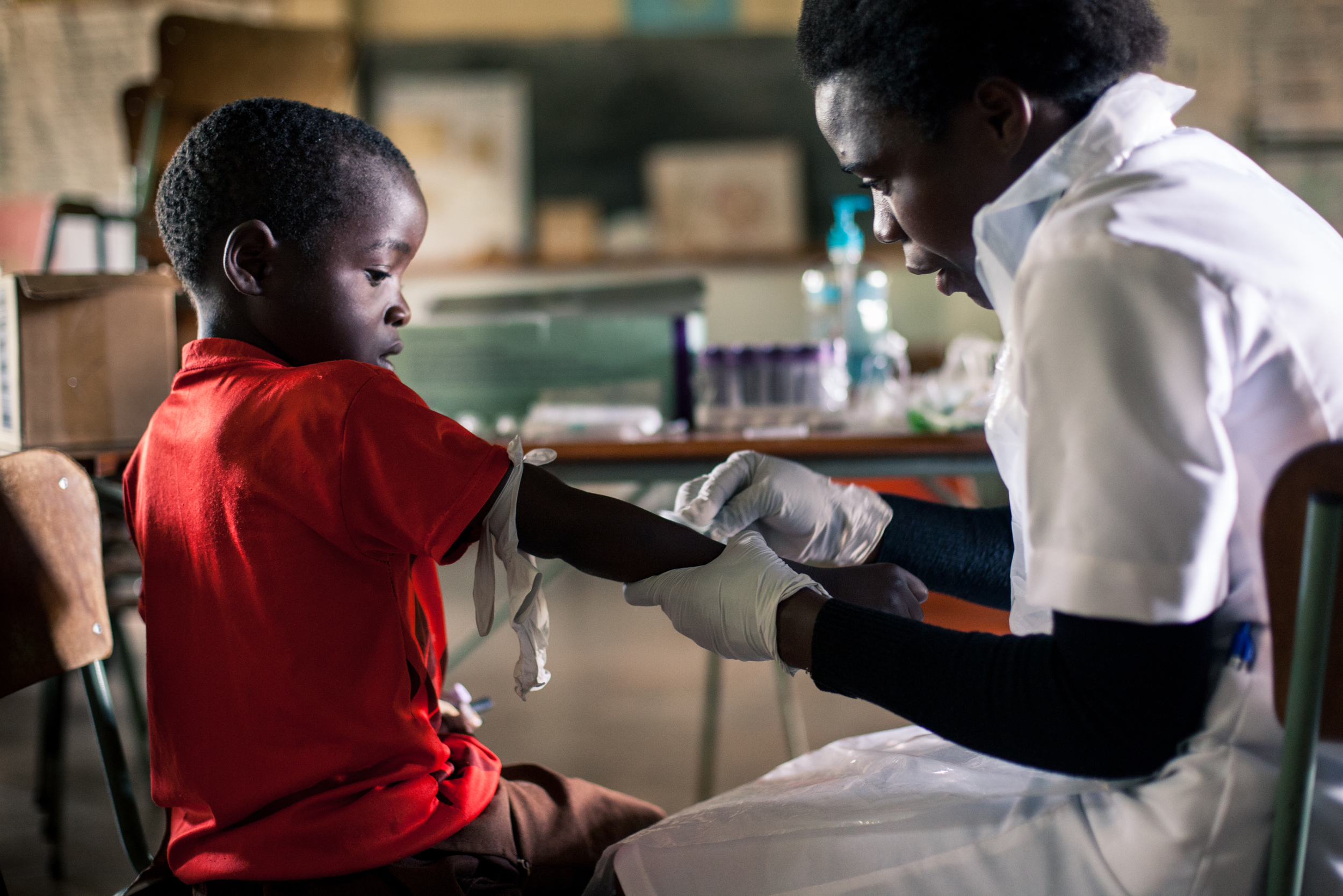 Hawa draws blood in a classroom of one of the largest primary schools in the area.