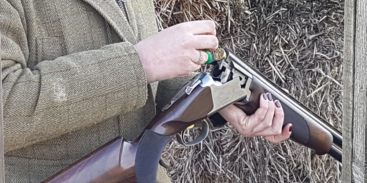 Loading a gun at a clay shoot - photo by Stella Gooch