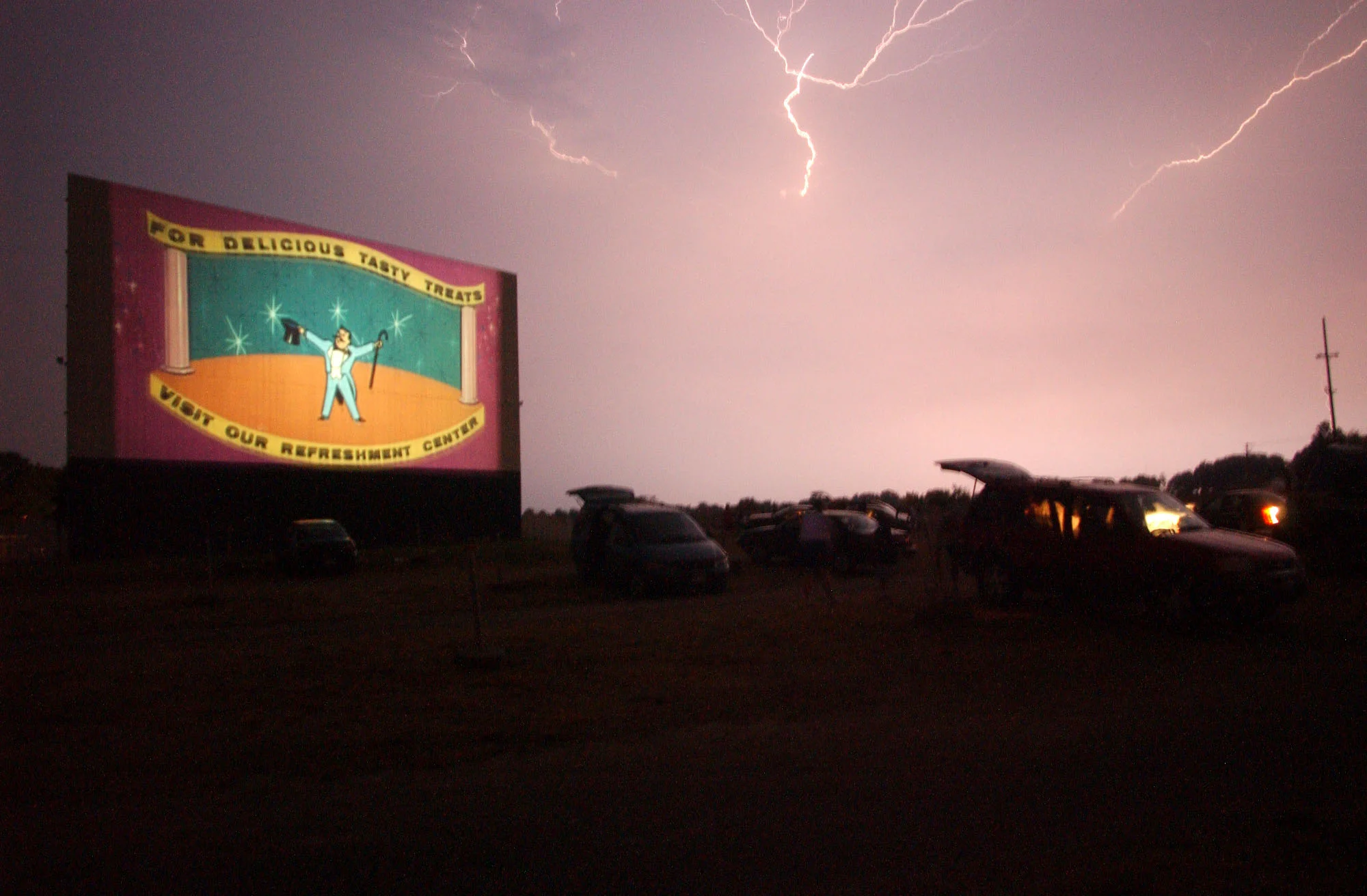   A thunderstorm approaches the Hi-Lite Drive-in East of Aurora, Illinois in 2002. The theater was demolished in 2005 to make way for townhouses.  