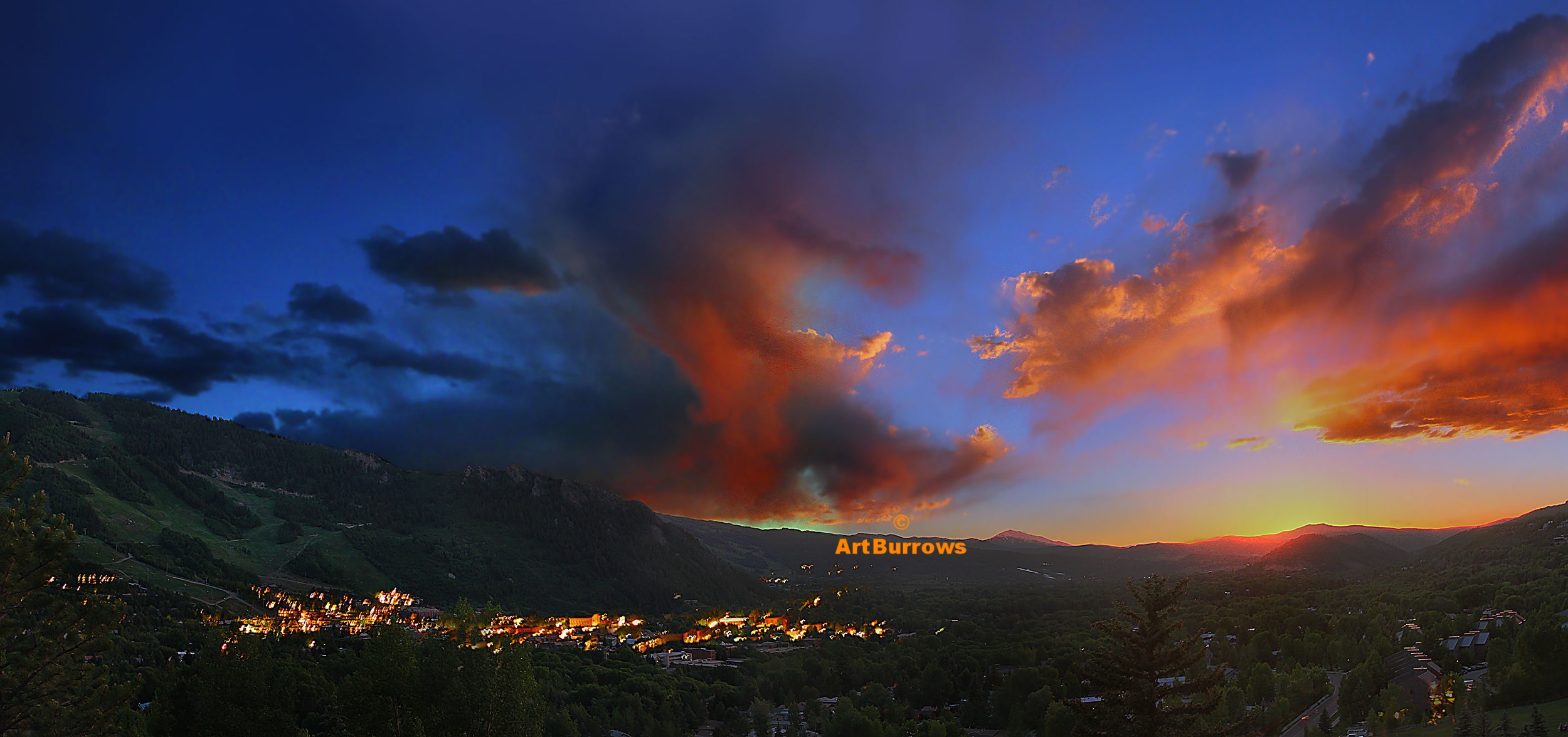 Aspen, Colorado sunset with town lights.
