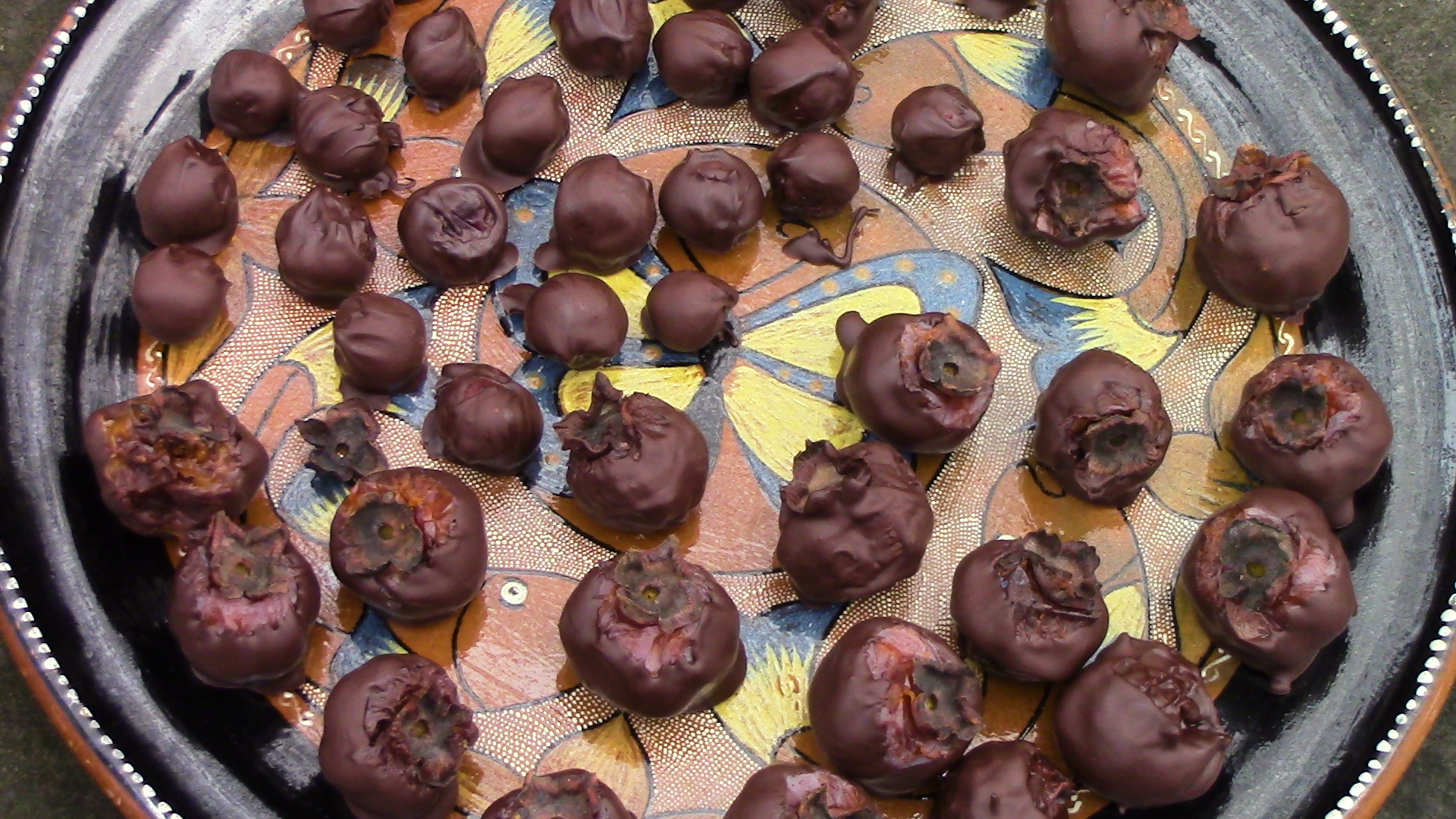 The platter contains American persimmons and whiskey infused Morello cherries enrobed in bittersweet chocolate.