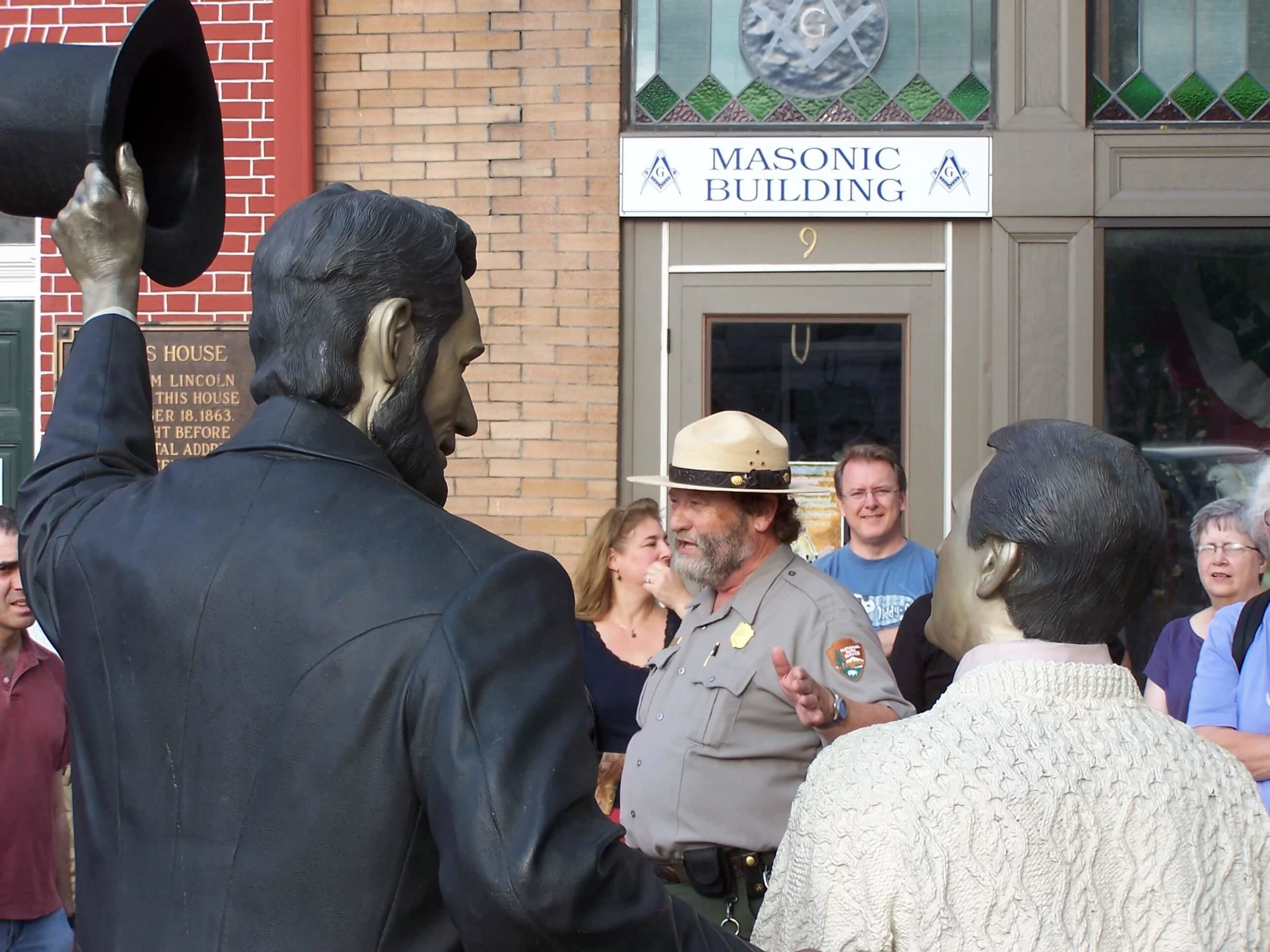 A National Park Service Park Ranger in front of the David Wills House
