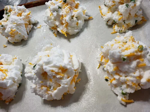 Shape fluffy whites into clouds.