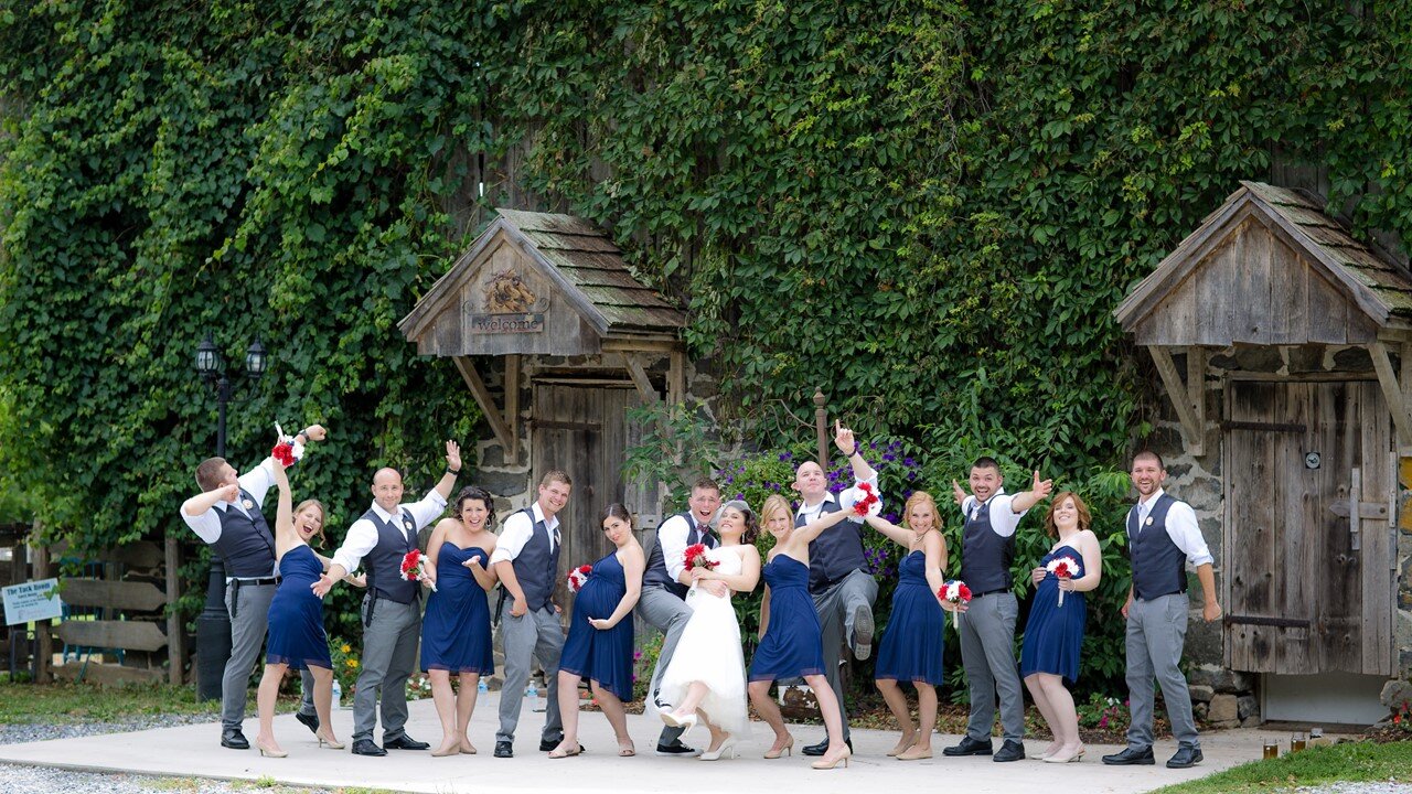 Wedding Party In Front of Historic Barn