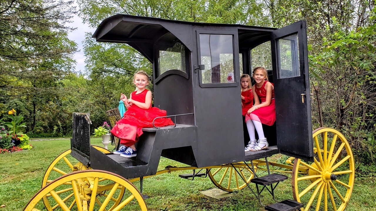 Carriage in Garden for Photo Op or Gift Table