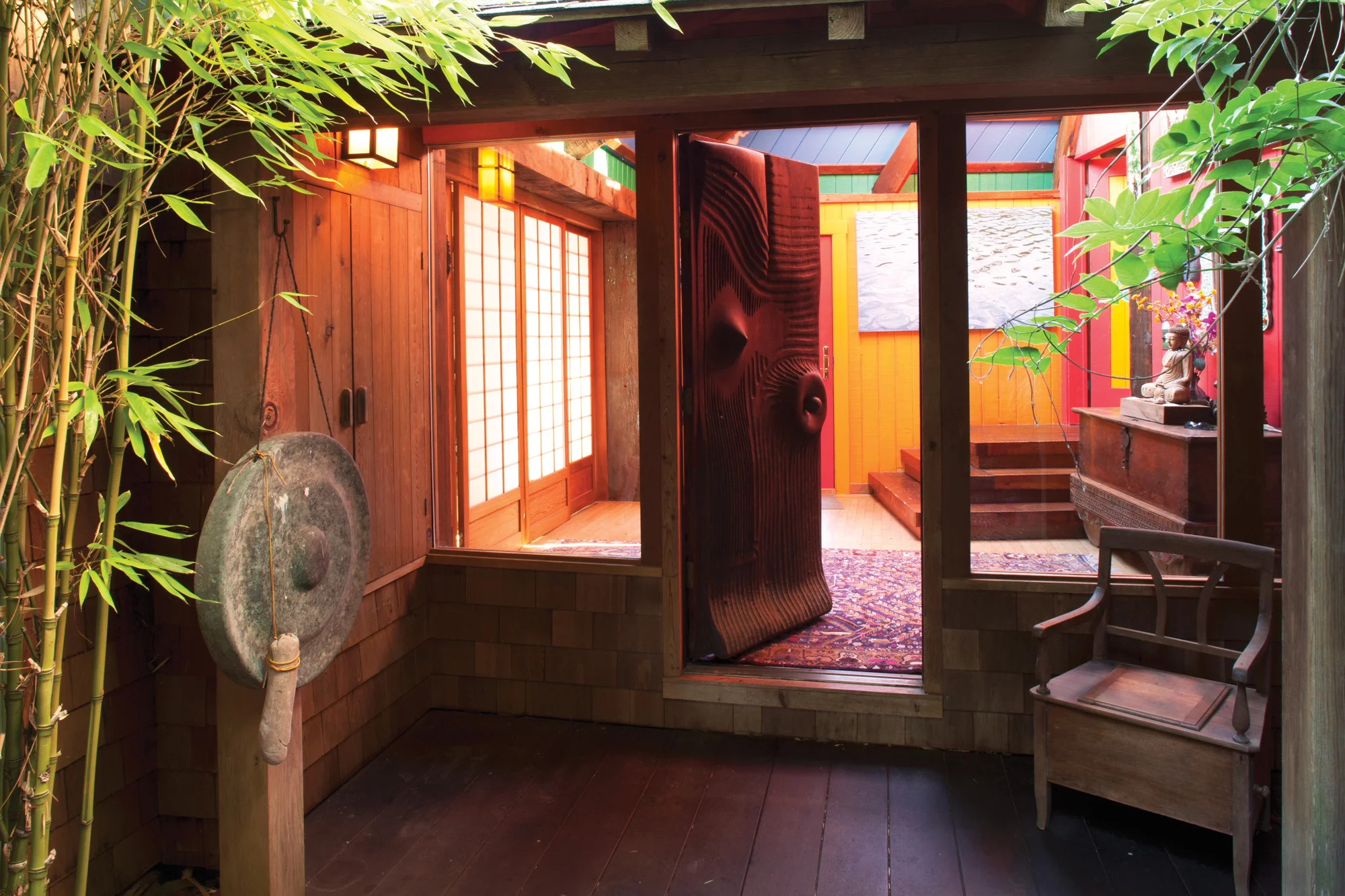The house's formal entrance features a monumental chainsaw-carved door made of reclaimed solid redwood, all the work of the late sculptor J.B. Blunk.